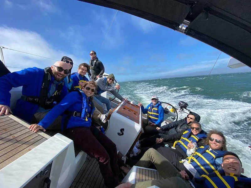 Team sailing together on San Francisco Bay in life jackets